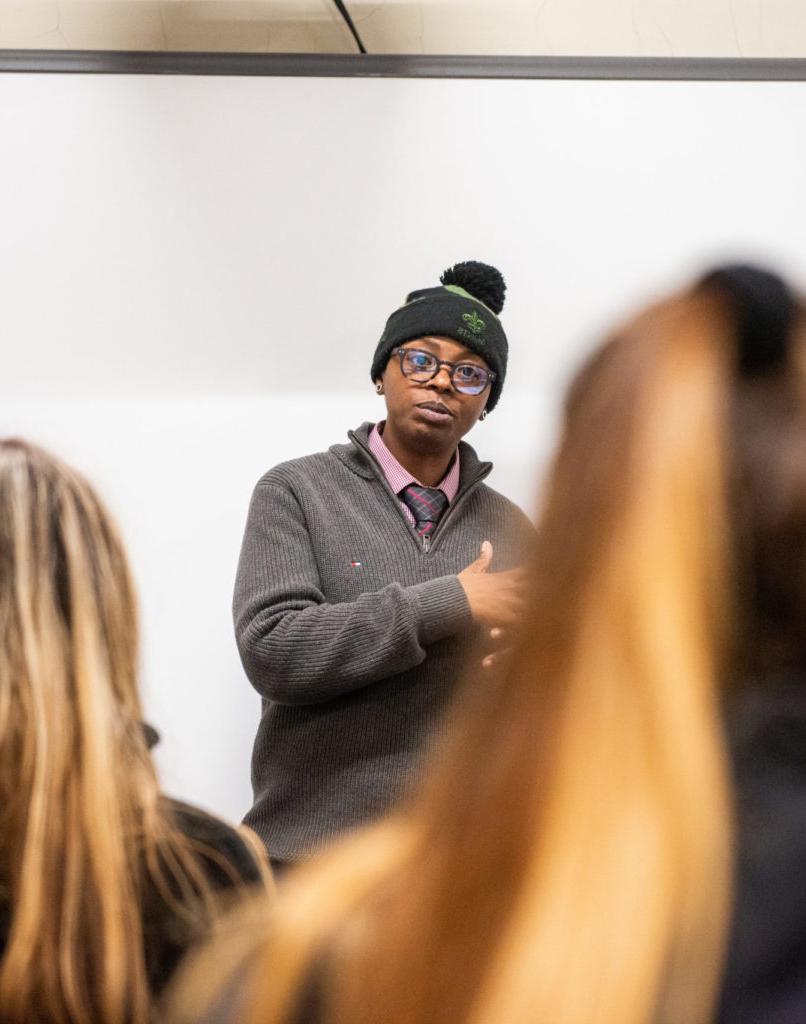 Public health professional speaking to a class.